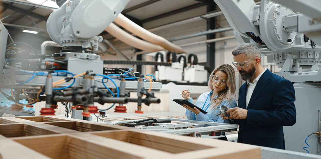 female engineer and male project manager standing female engineer and male project manager standing