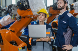 engineers working robot assembly industry plant