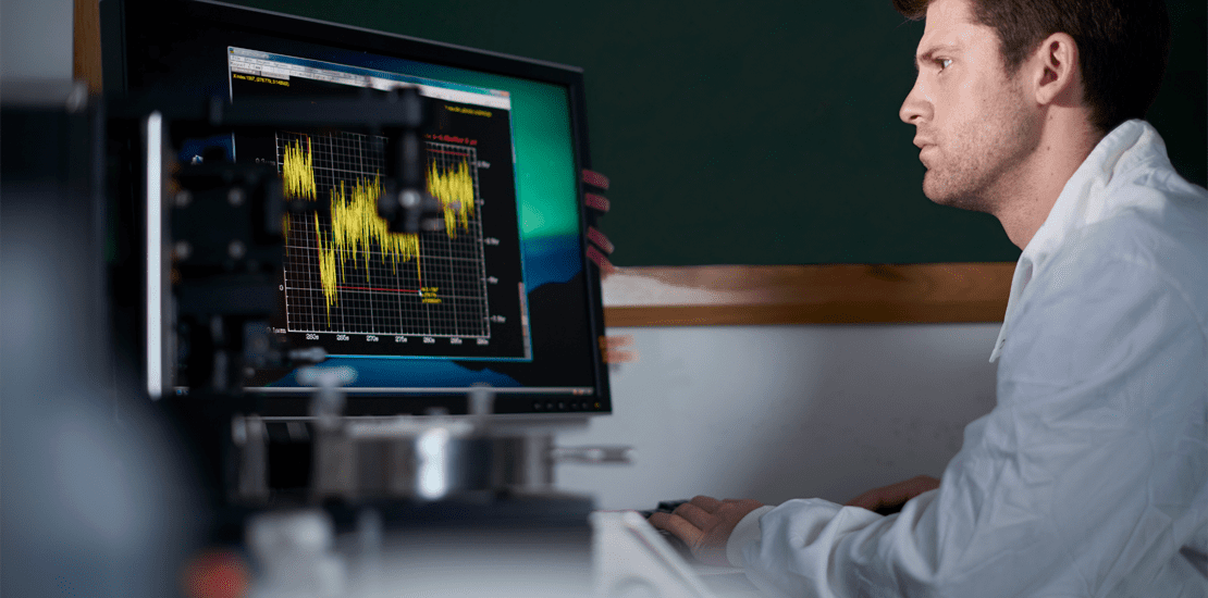 scientist analyzing data on computer screen