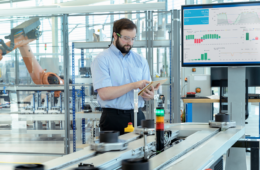 engineer testing a robotic production simulator