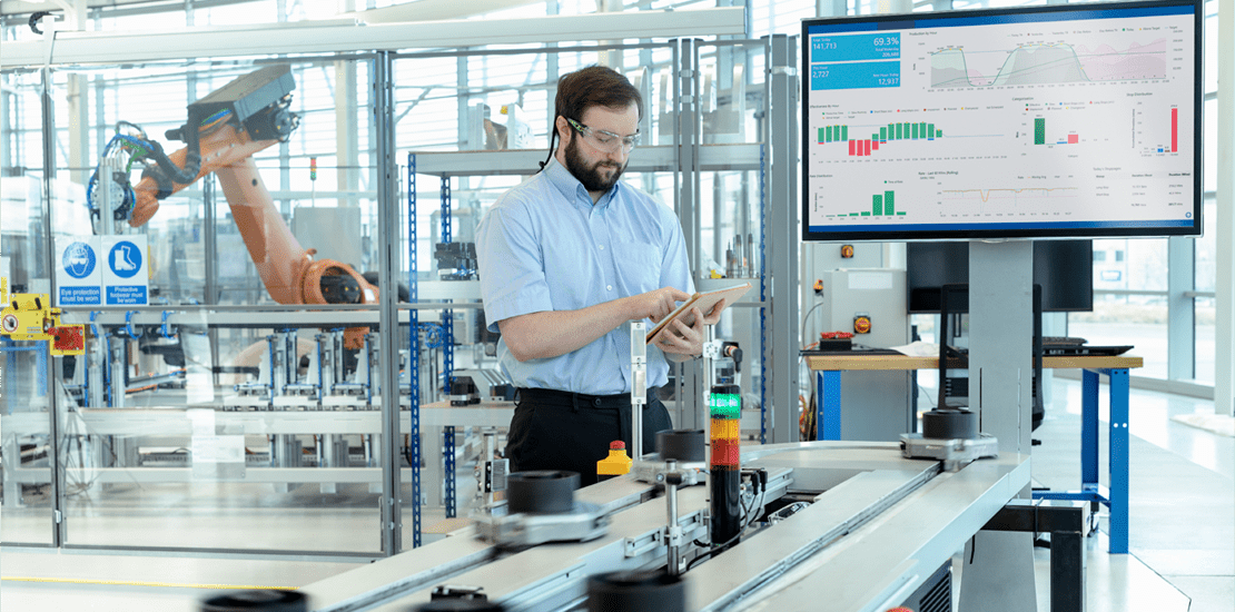 engineer testing a robotic production simulator